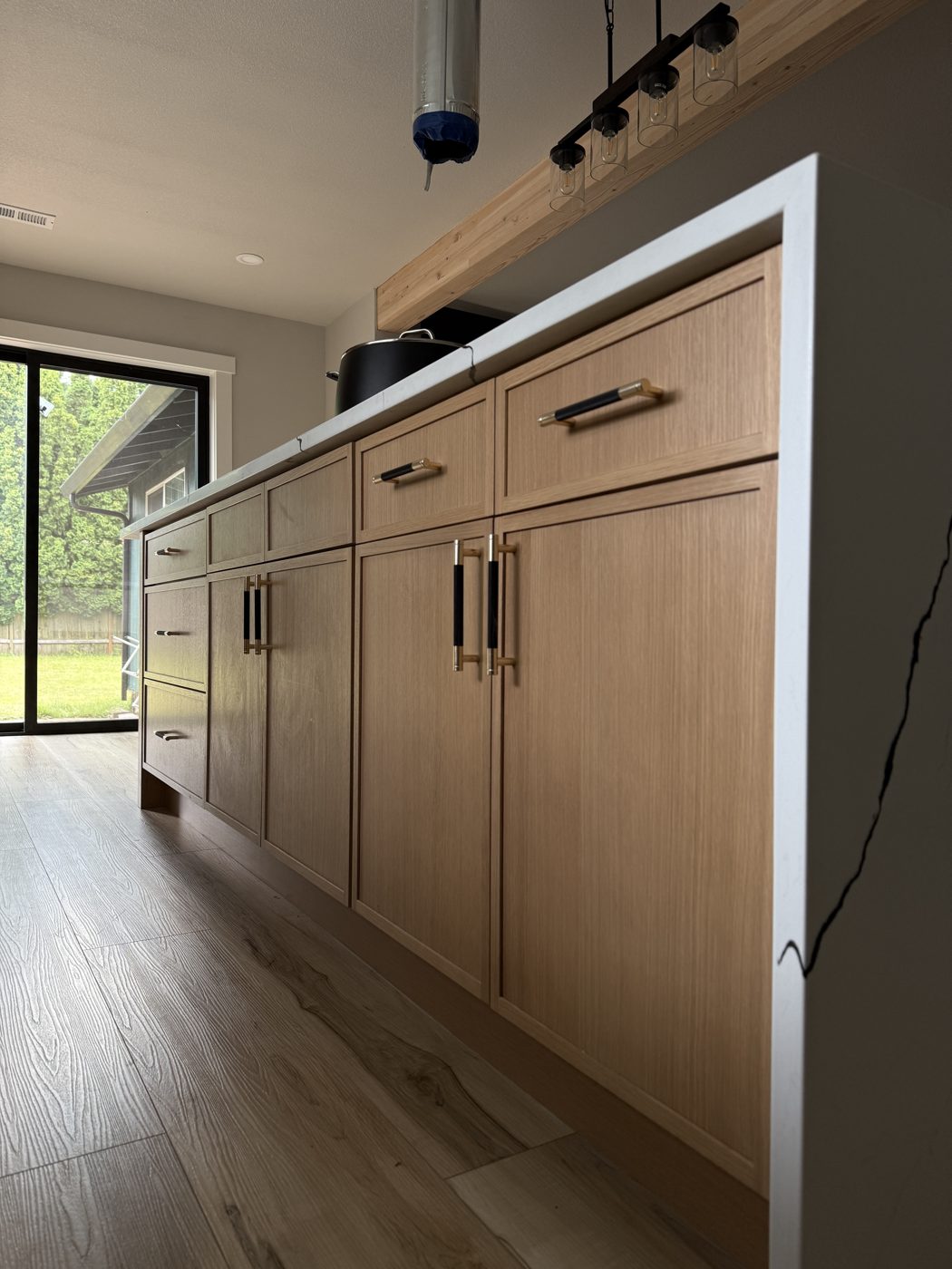 Warm oak plank floor in a finished kitchen